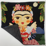 Decorative pillow with a stylized portrait of a woman holding a heart, surrounded by flowers and leaves.