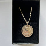 Coin pendants by Strange Change